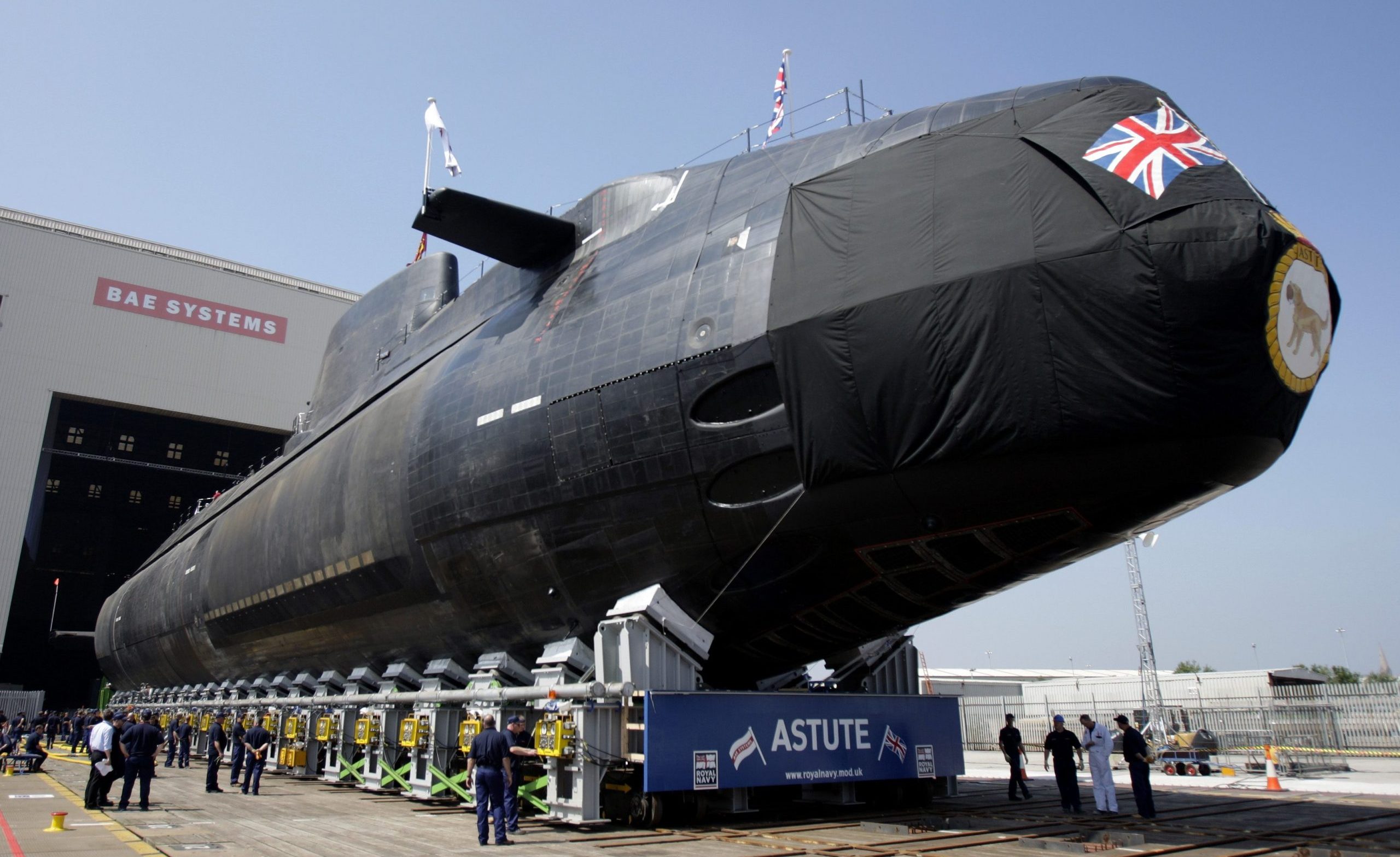 Britain's Royal Navy nuclear-powered submarine HMS Astute is launched at the Devonshire Dock Hall in Barrow-in-Furness, northwest England in a June 8, 2007 file photo. A British Royal Navy nuclear-powered submarine ran aground off the coast of Scotland on Friday, a Ministry of Defence spokesman said. "This is not a nuclear incident," the spokesman said. "There are no injuries to personnel and the submarine is watertight".  REUTERS/Kieran Doherty (BRITAIN - Tags: MILITARY DISASTER CIVIL UNREST)
