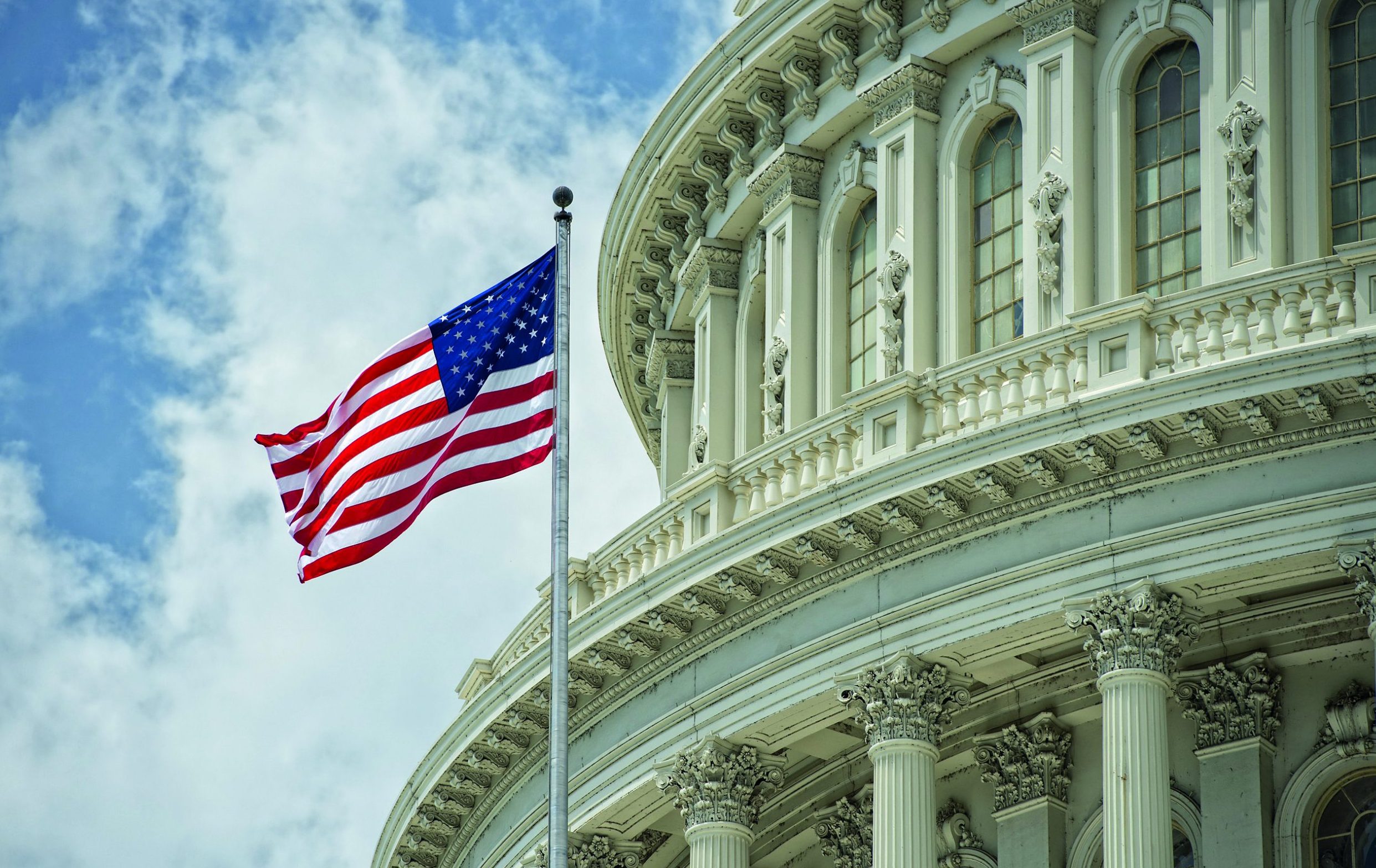 Washington,Dc,Capitol,Dome,Detail,With,Waving,American,Flag