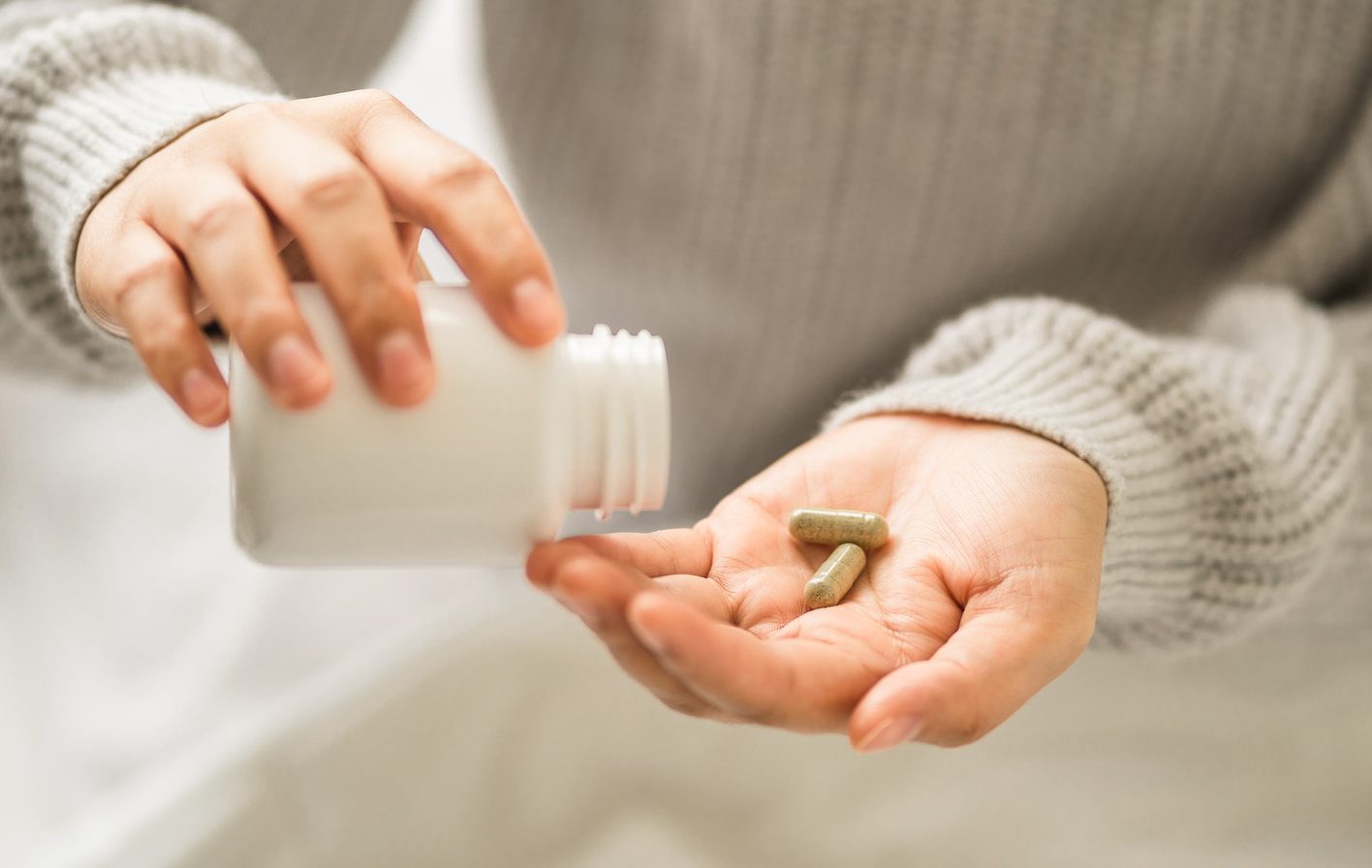 Hands,Young,Women,Holding,Medical,Capsules,,Female,Taking,Supplement,Product
