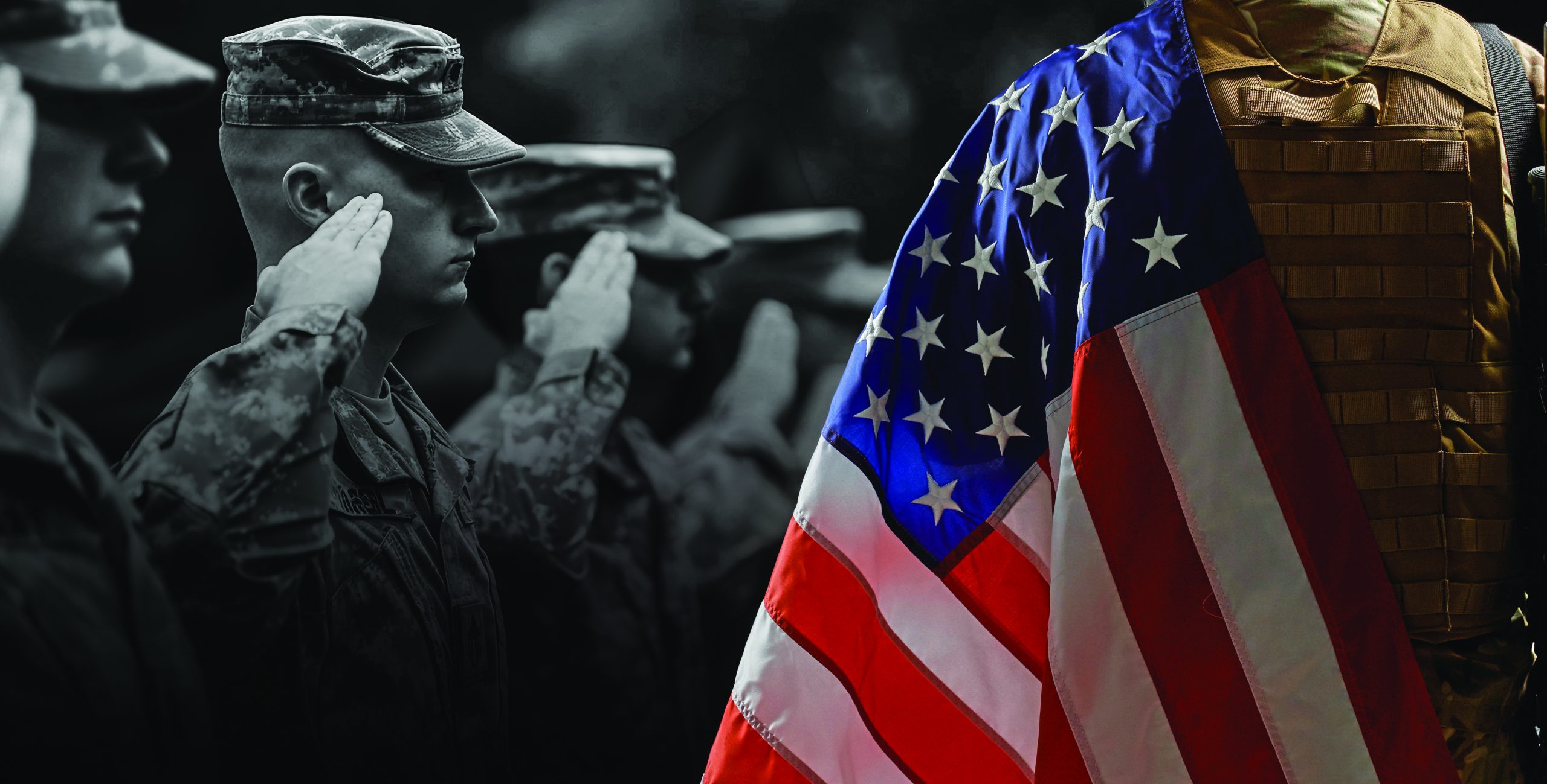 Back view of american military soldier holding flag and rifle on shoulder. Crop of incognito male officer in camouflage uniform posing in dark atmosphere. Concept of military, army.